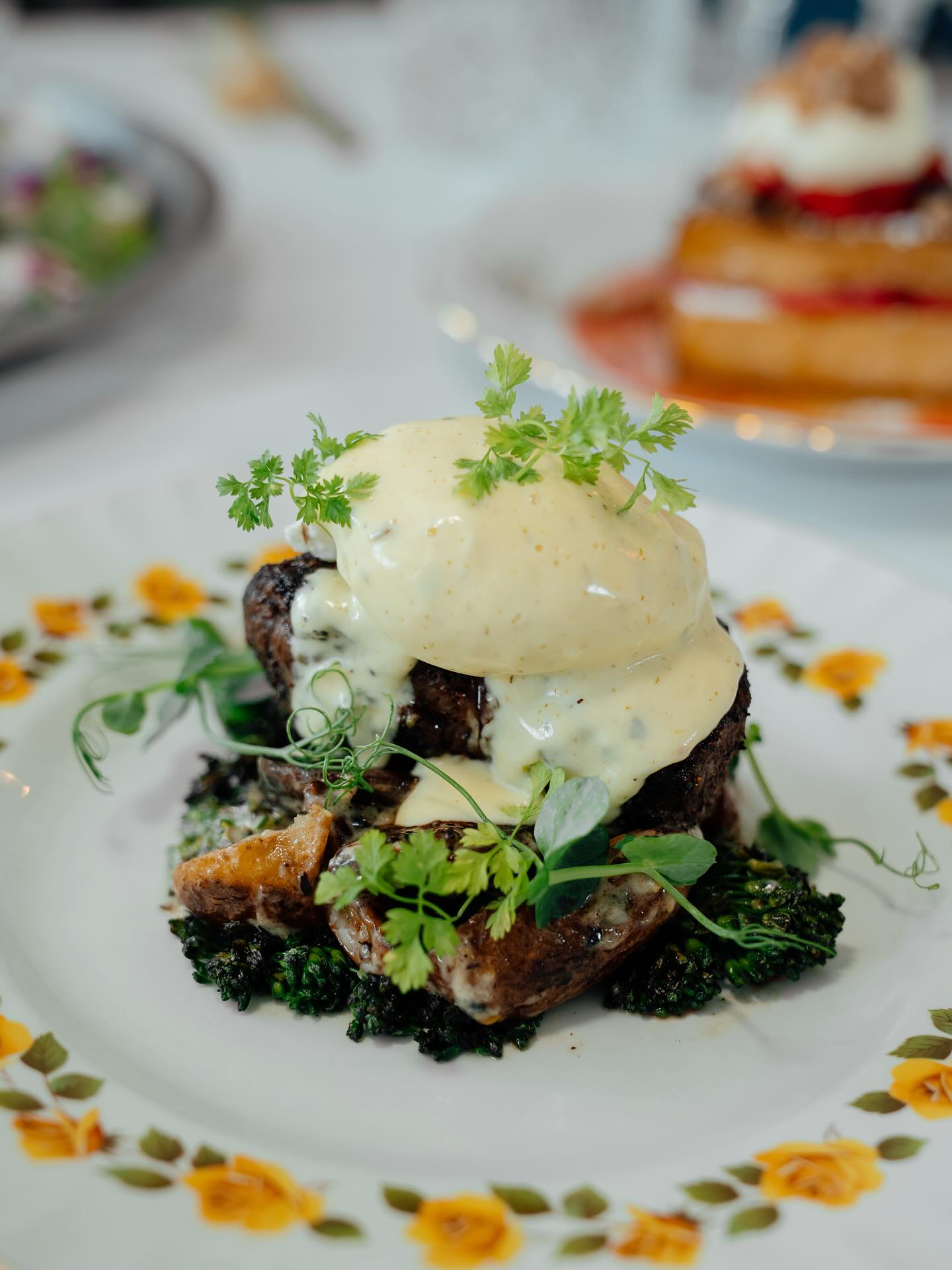 A brunch plate under a poached egg and hollandaise