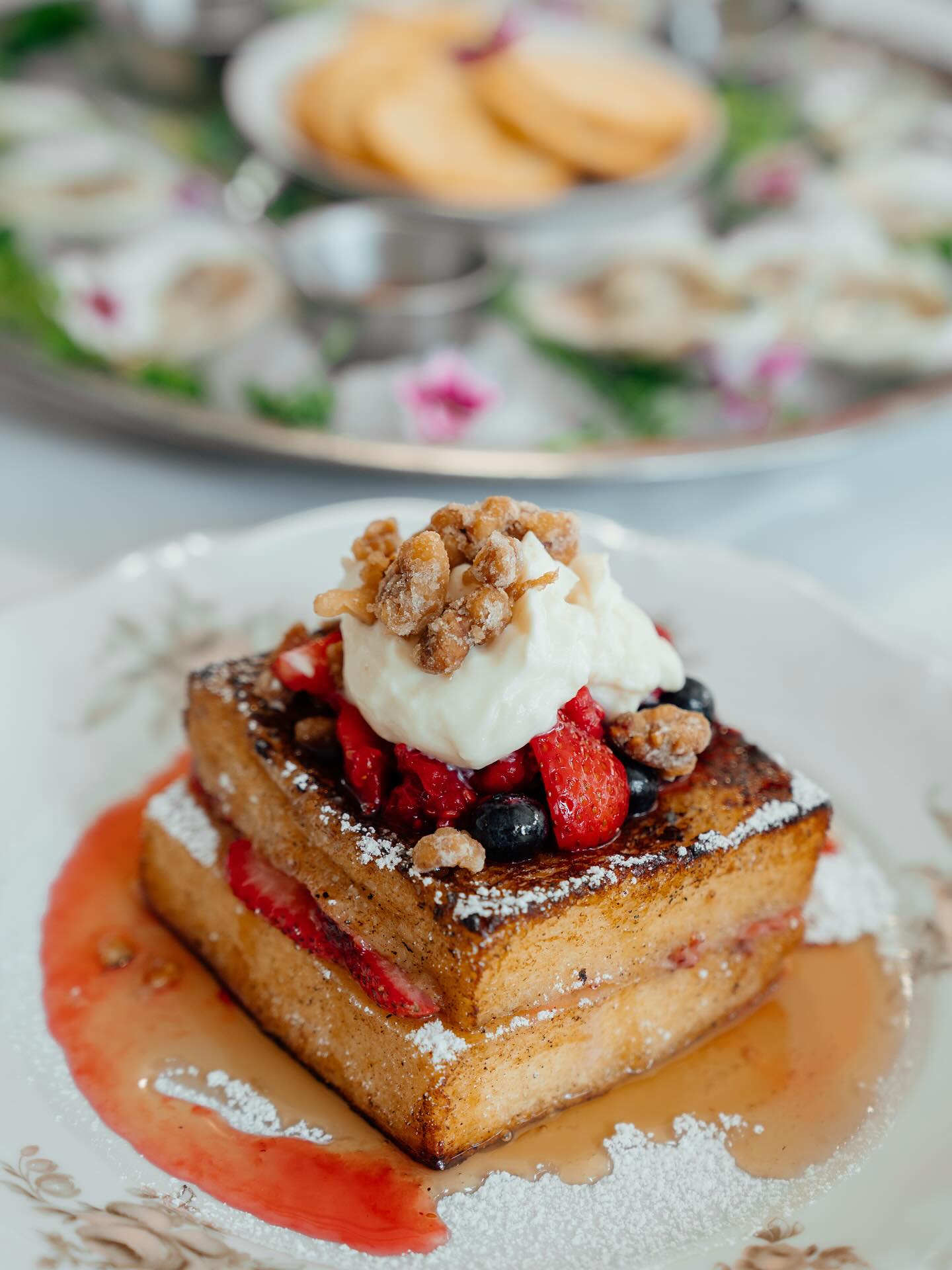Thick French toast with berries, cream and candied nuts