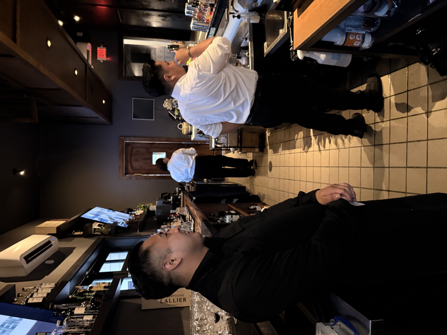 The service counter at the end of the bar during a shift